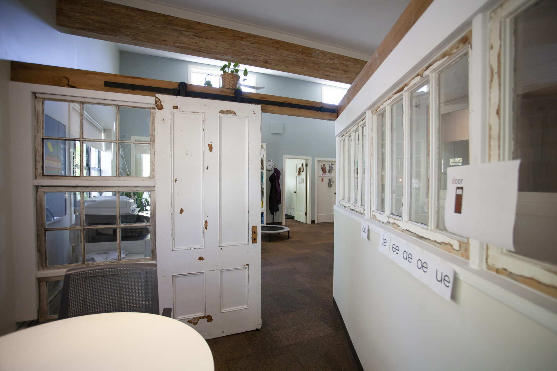 Entrance hallway at Novaread learning centre with phonics vowel cards on window ledge