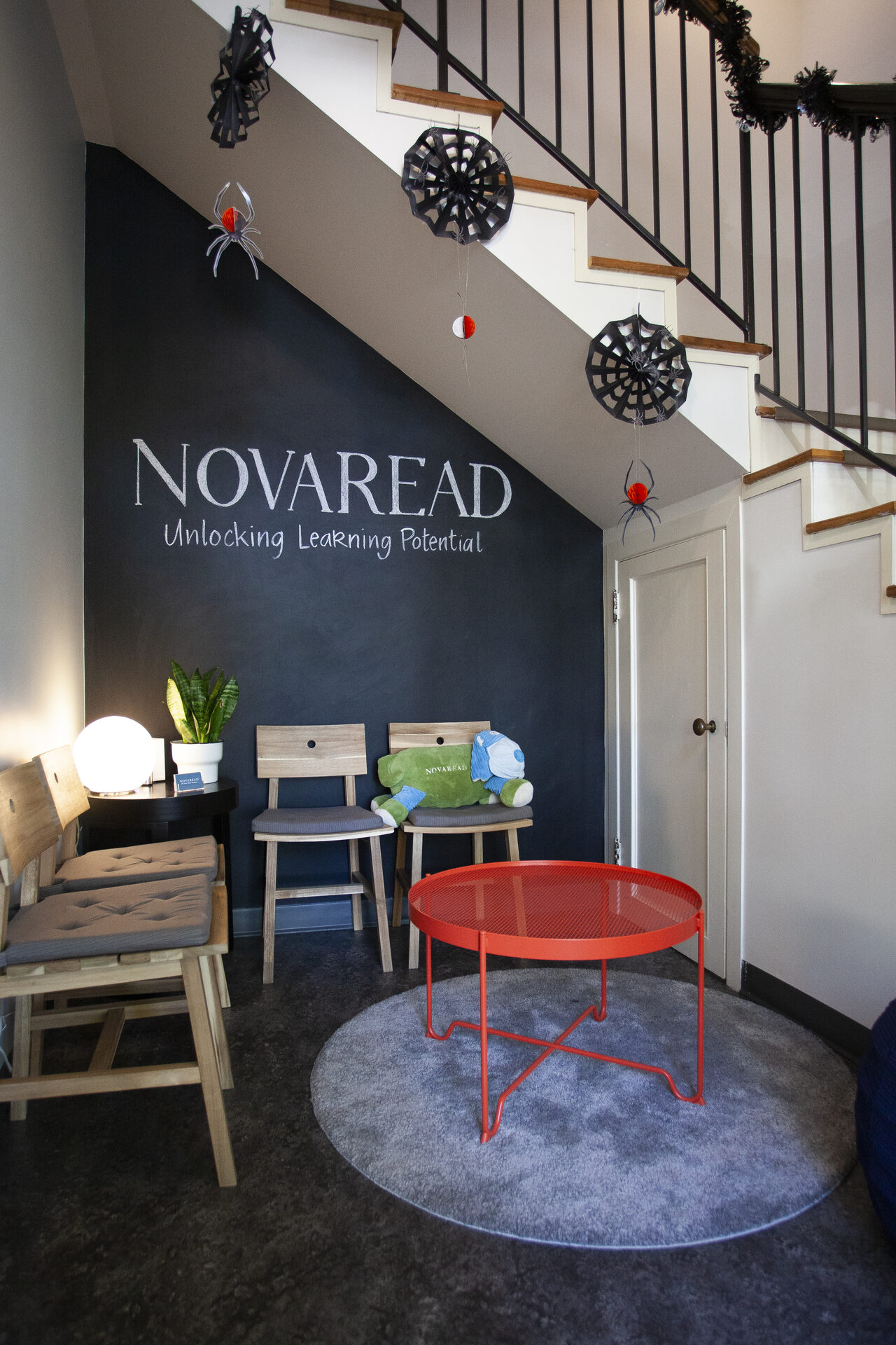 Novaread learning centre reception area with brand wall reading Unlocking Learning Potential