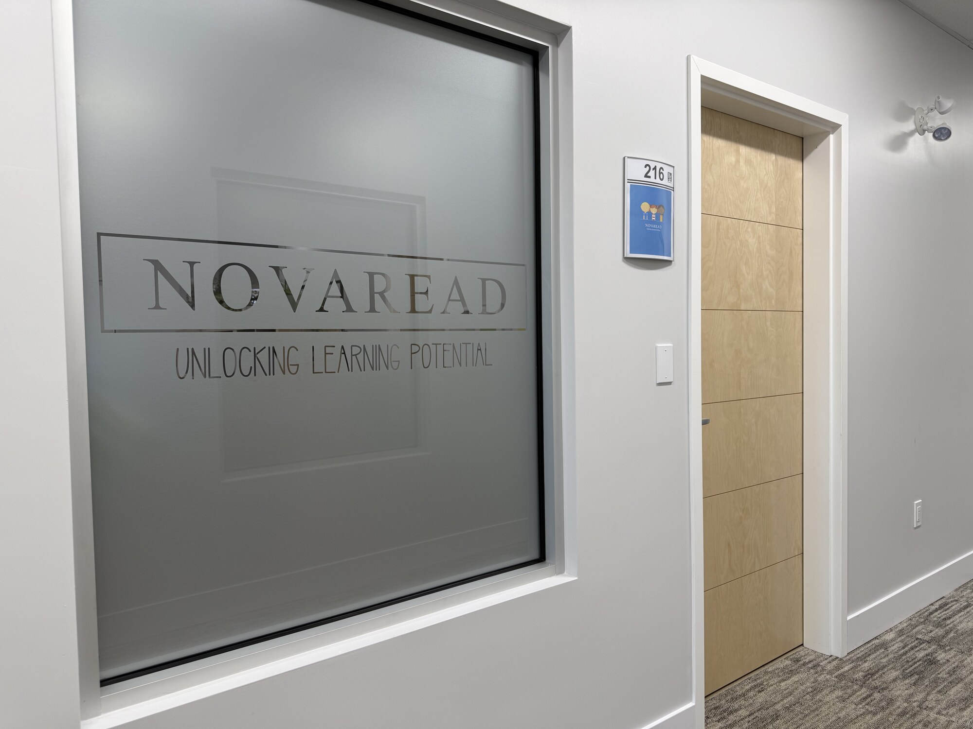 Novaread Bedford clinic entrance with frosted glass logo, Unit 216, 620 Brookline Drive