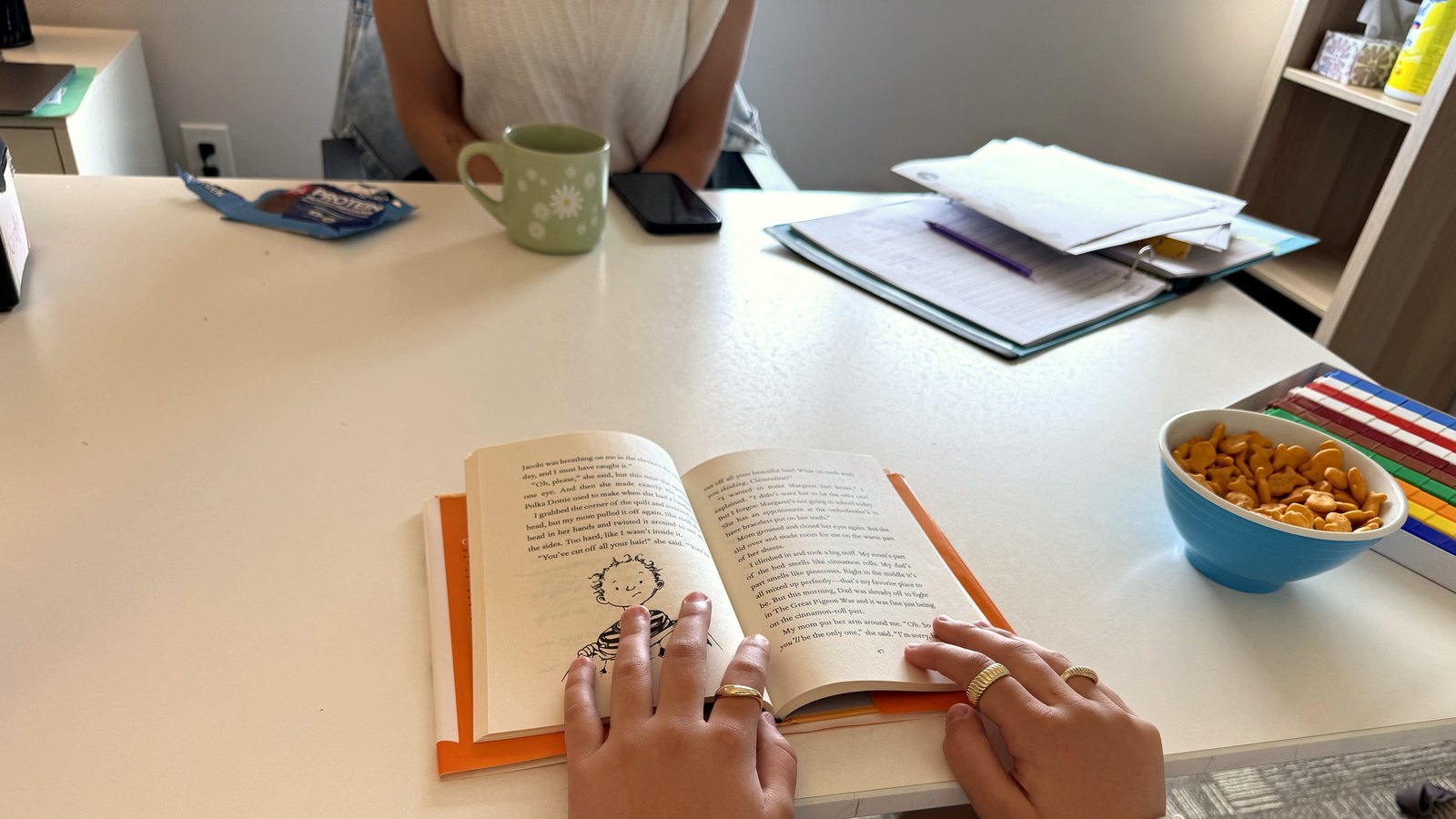 A student and Novaread instructor reading a chapter book together during a one-on-one session