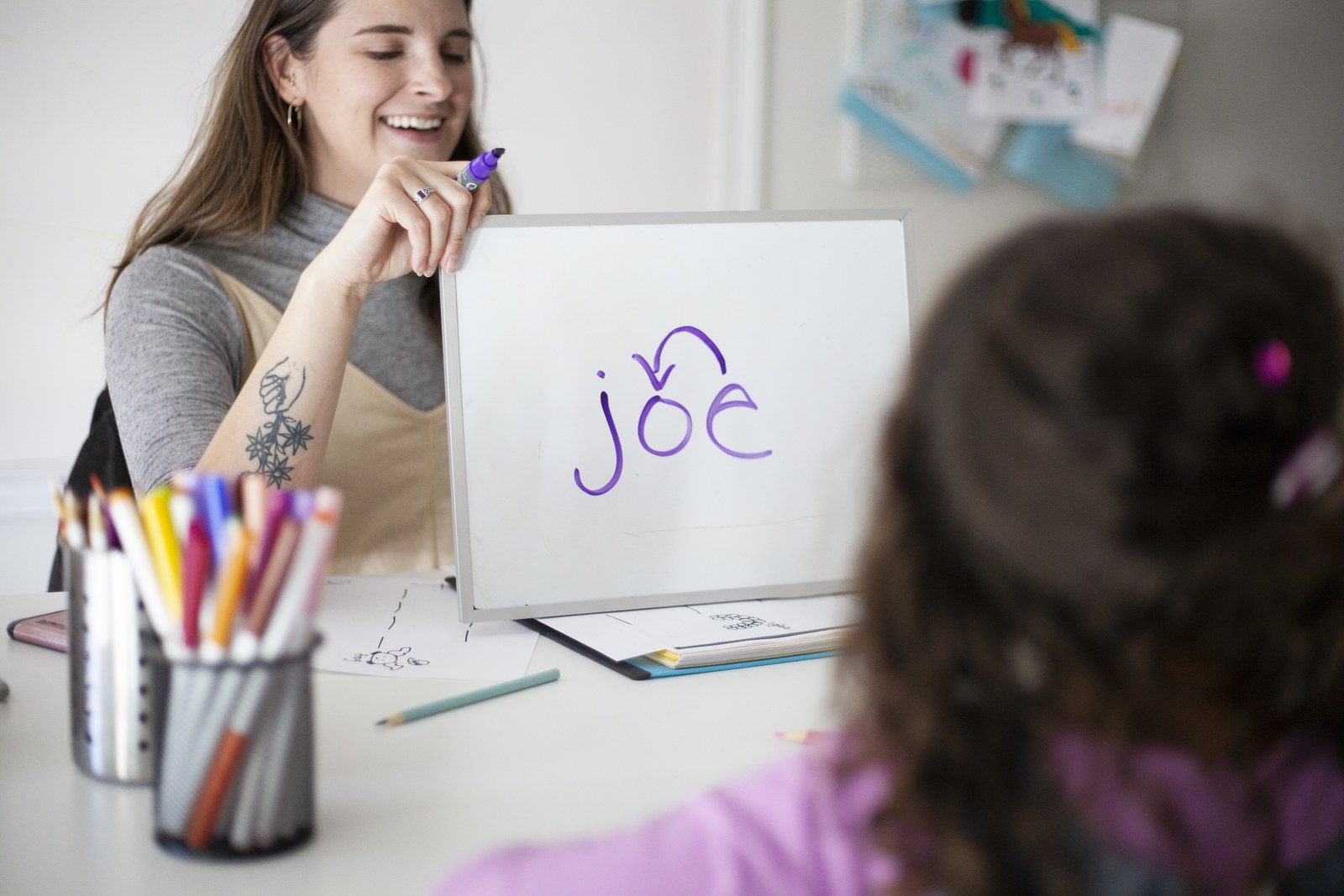 Young student writing during a Novaread session